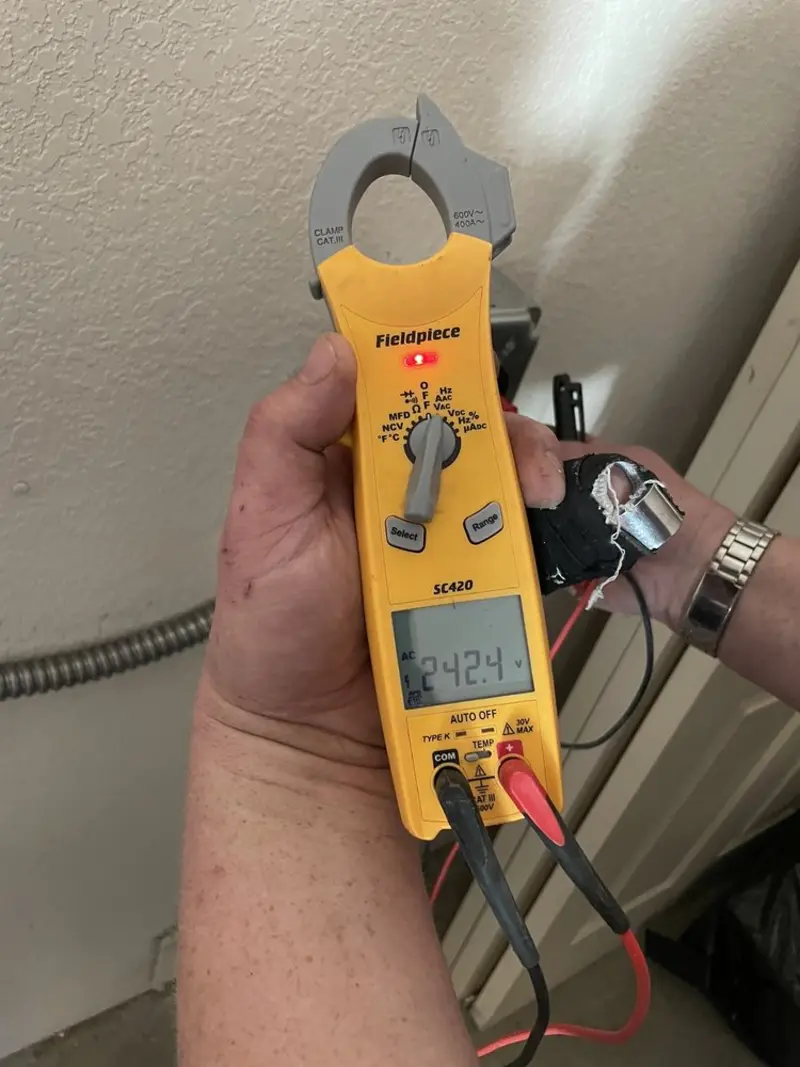 Voltage testing with clamp meter during Ceiling Fan Installation in Perryville